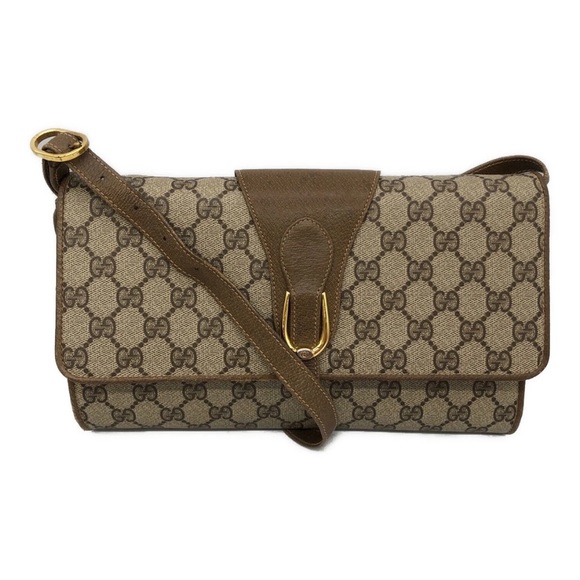 Gucci Handbags - Gucci Brown Monogram Clutch with Gold Accent